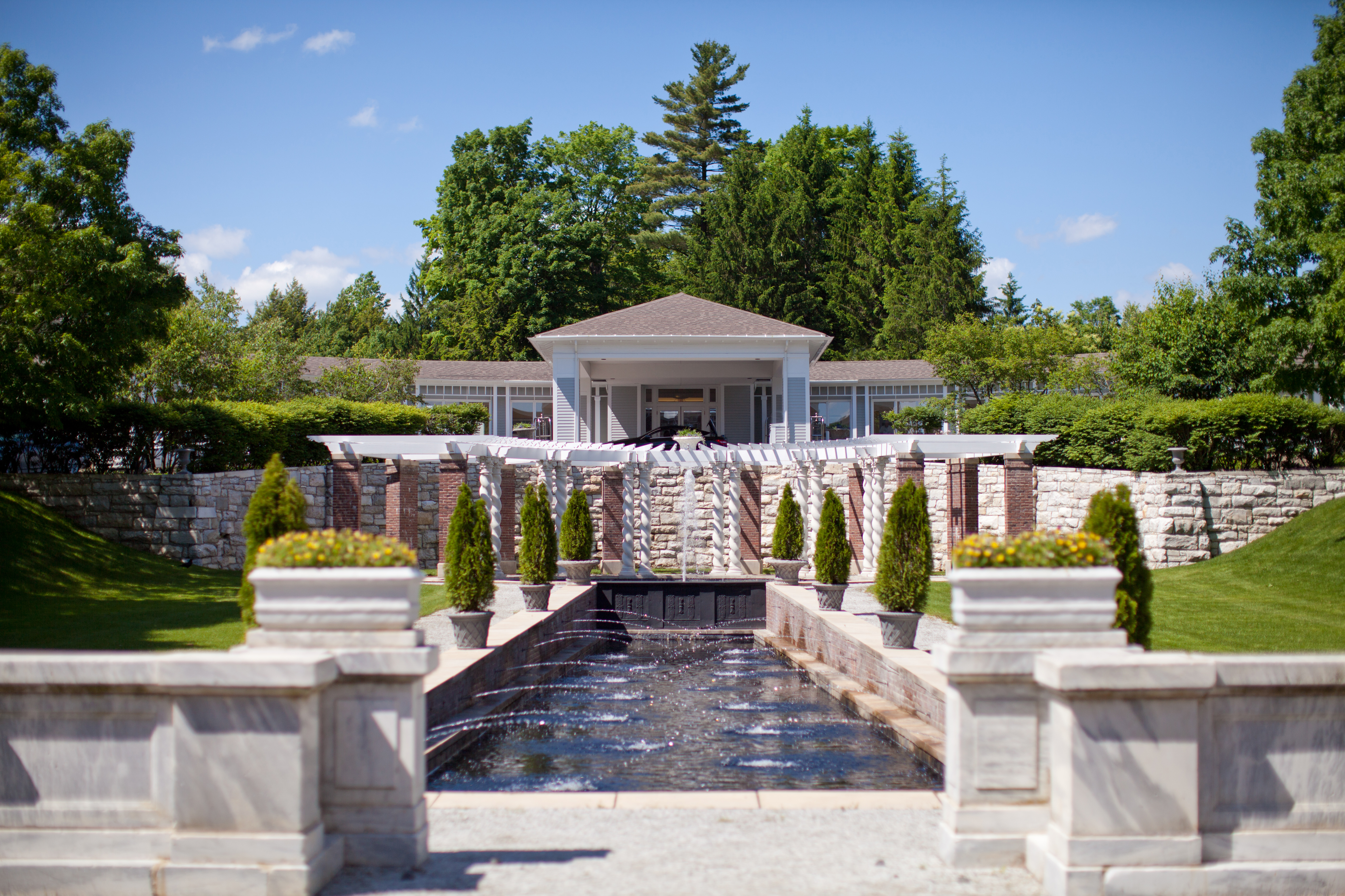 https://nashvilleedit.com/wp-content/uploads/2019/02/pavilion-water-reflection-pond-trees-canyon-ranch-wellness-resort-lenox-1.jpeg