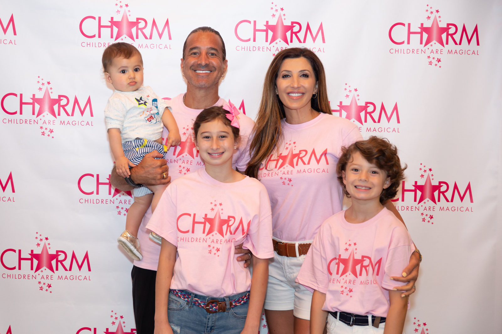 Jaclyn Stapp, husband Scott Stapp from Creed and touring solo artist, pictured with their three children at the CHARM fundraiser.