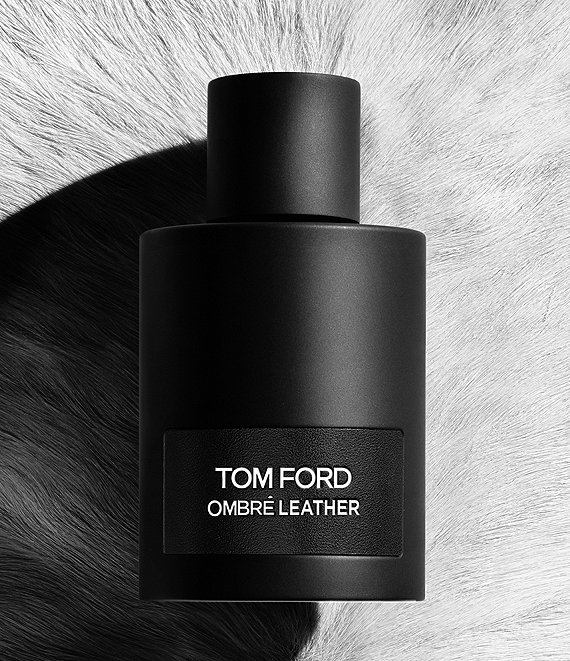Tom Ford cologne and fragrance, black bottle and marble background.
