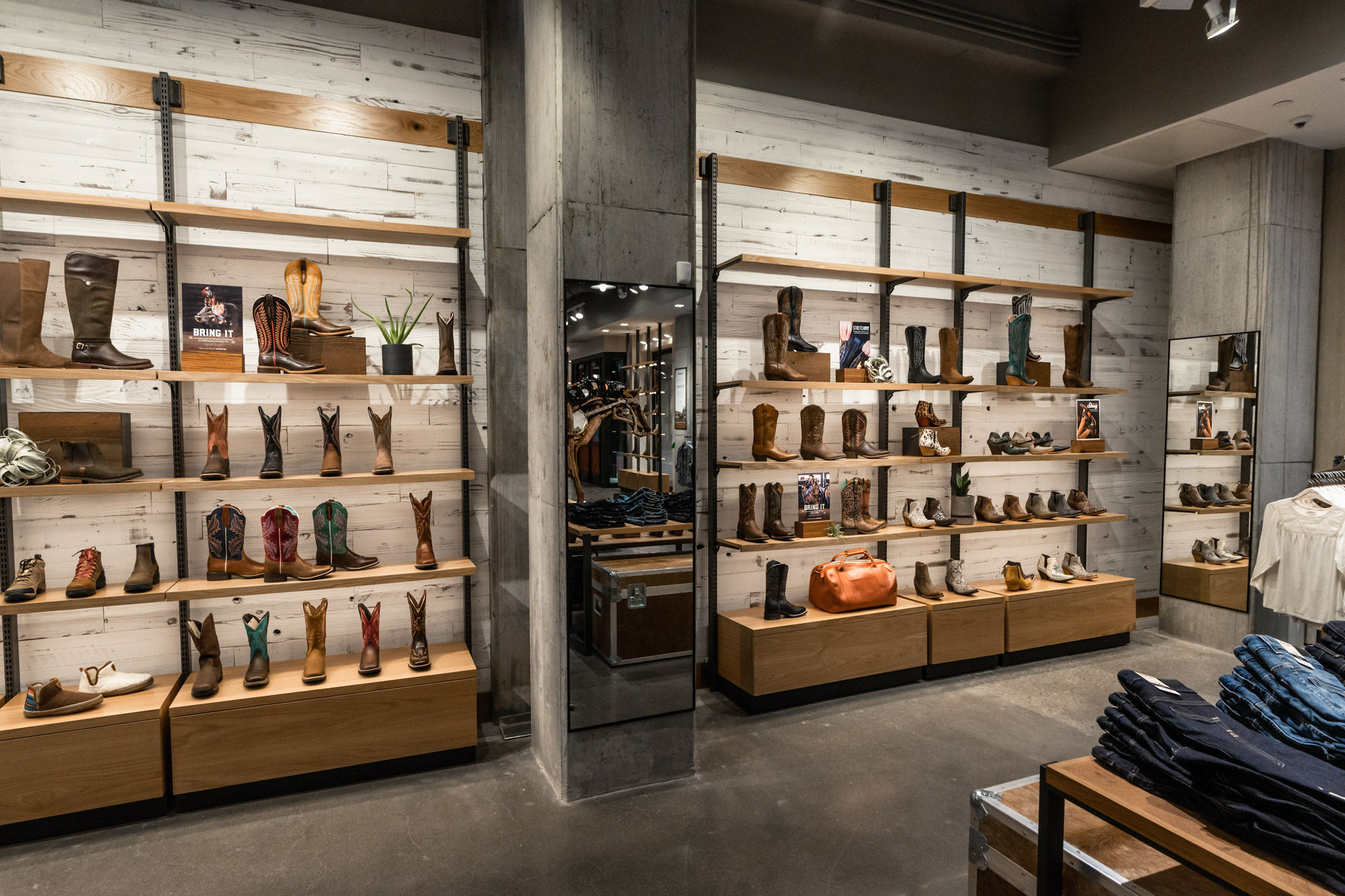 ariat store boot wall and jeans