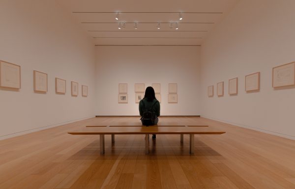 Harding Art Show: Woman sitting in an art gallery