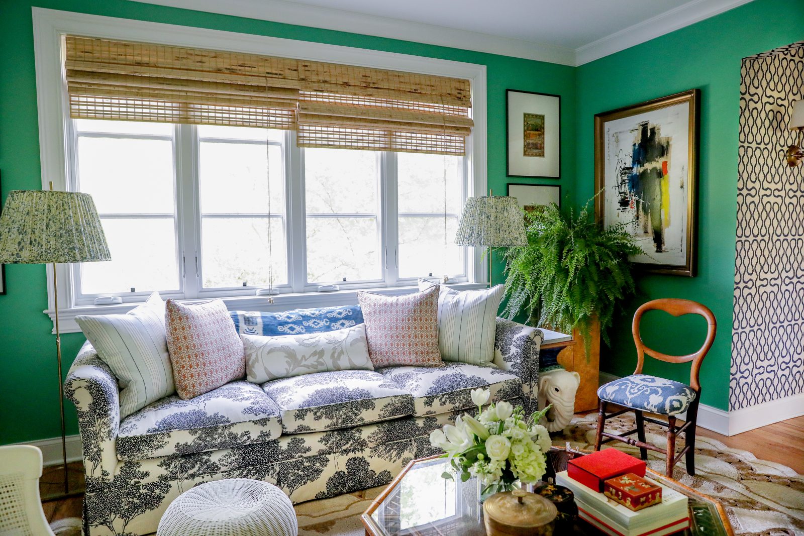 Green living room with blue and white accents and aesthetics