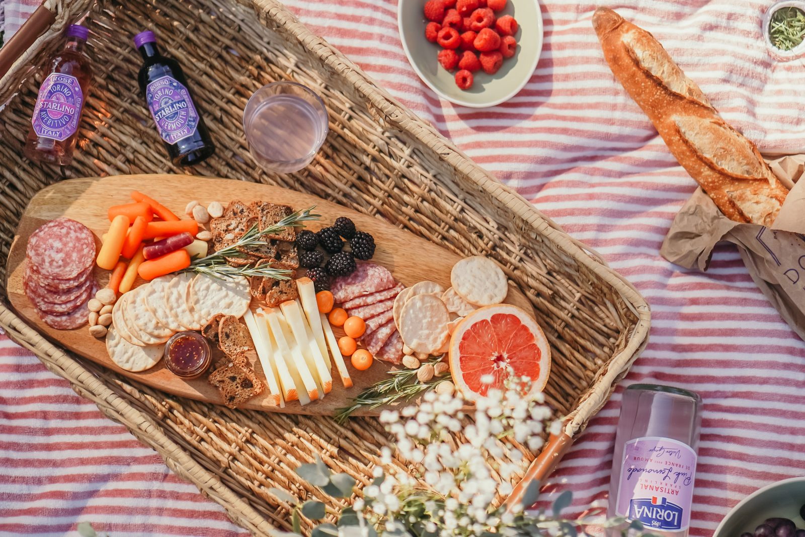 Charcuterie board for a nashville picnic. Served with a baguette and french Lorina.